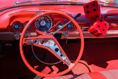 Red car interior with red dice