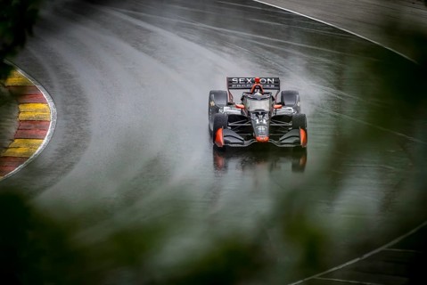 SANTINO FERRUCCI (14) of Woodbury, Connecticut comes through turn 12 (Canada Corner) during a wet
