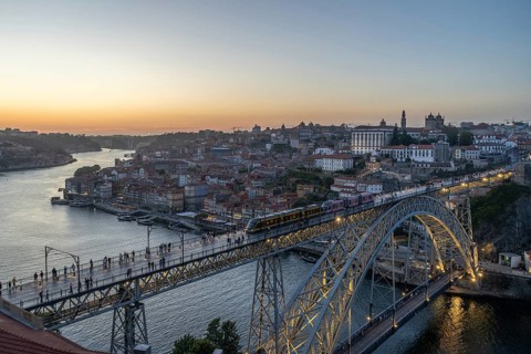 Illuminated Porto City, Douro River and Dom Luis bridge I with Tram. View from Tourist Viewpoint