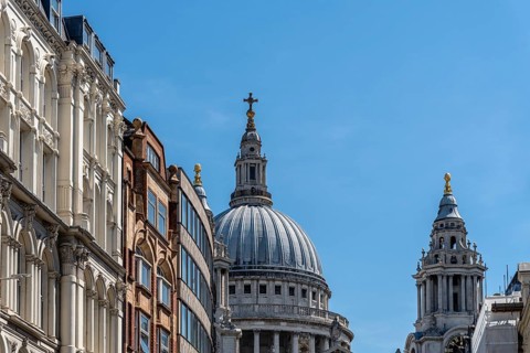 Low angle view of the Dome of St Paul Cathedral from Ludgate Hill against sky