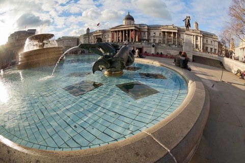 Trafalgar Square fountain in London, United Kingdom. Shot taken fisheye wide angle lens, which