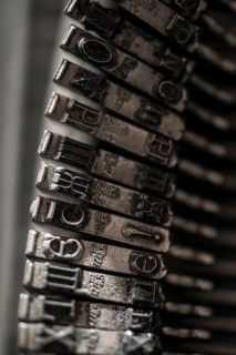 Metal letters on typewriter. Close up macro