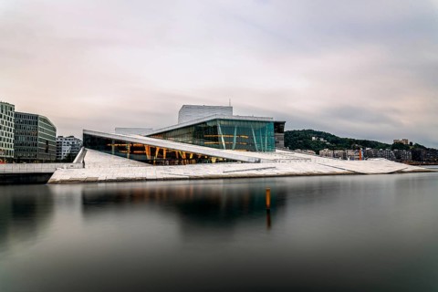 Oslo, Norway, August 10, 2019: Exterior view of Opera house in Oslo. Long exposure at dusk. New