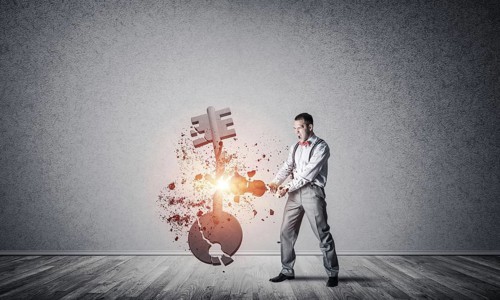Determined businessman in empty interior breaking with violin stone key figure