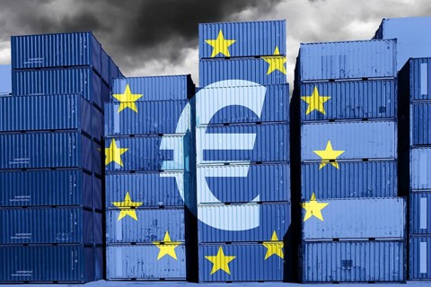 Stacked containers with EU flag and euro sign, customs duties levied on deliveries from low-cost