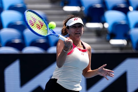 MELBOURNE, AUSTRALIA - JANUARY 10: Iva Majoli of Croatia partners Mansour Bahrami of France in the