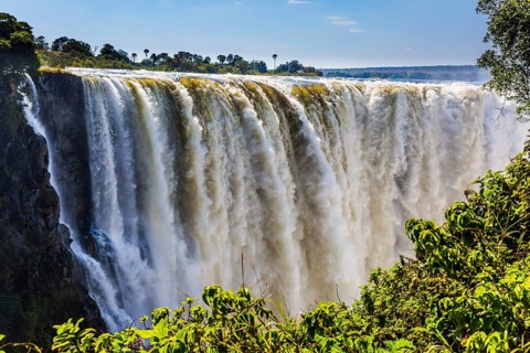 Journey after the wet season. Grand and deep Victoria Falls after the rainy season. Victoria