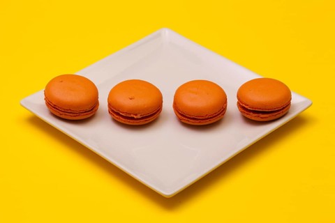 Traditional french colorful macarons on the white plate