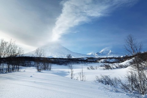 Beautiful volcanic landscape of Kamchatka Peninsula: evening view of eruption active Klyuchevskoy