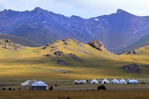 Yurt camp and high mountains at Lake Songköl (Son Kul, Song Kol), Kyrgyzstan
