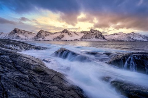 Beautiful winter landscape scene, sunset or sunrise in mountains and fjords