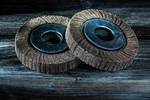 Used abrasive discs on vintage wooden board