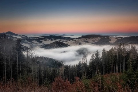 Fog over the Liptov village of Velke Borove before sunrise by Liptovska Mara in Slovakia
