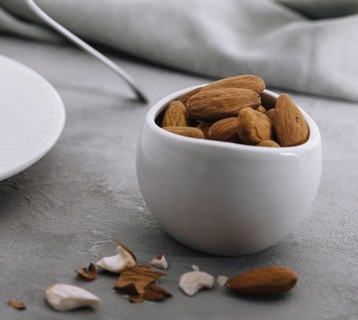 food still-life, Close up almonds on stone table