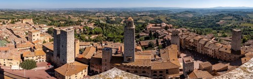 Wide panoramic view over downtown San Gimignano, Torri dei Salvucci and Torre Rognosa in the