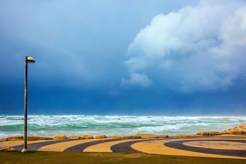 Mediterranean rages. Quay in Tel Aviv in stormy January day