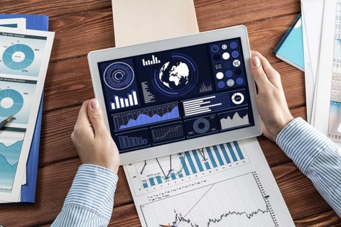 Close-up, the business lady with the tablet. Concept of Finance and Technology