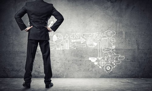Back view of confident businessman in empty concrete room