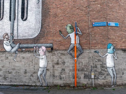 Large wall graffiti on the brick wall of buildings in Craenendonck Street, Leuven, Flemish Brabant