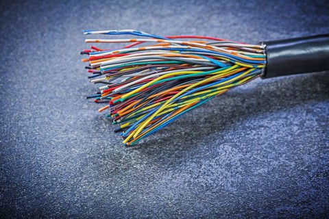 Multicolored electric cables on black background electricity concept