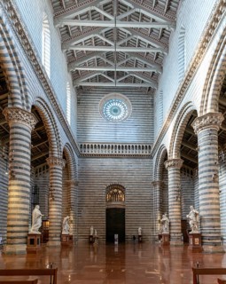Orvieto, Italy, 18 November, 2023: interior view of the Orvieto Cathedral central nave with pews