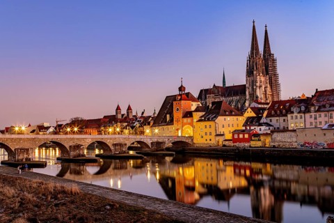 View of Regensburg Cathedral and the stone bridge over the Danube in winter in Regensburg, Bavaria,