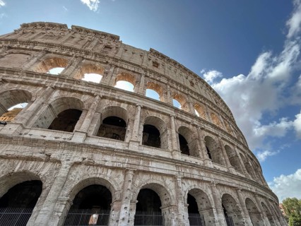 Majestic Colosseum, taken from below with a view of its arches and the sky, Rome, Italy