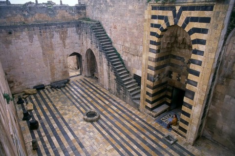 The Citadel of Aleppo is a large medieval fortified palace in the centre of the old city of Aleppo,