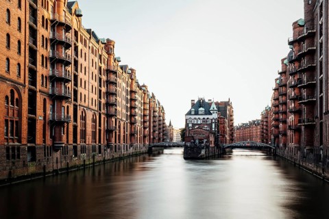 Long exposure view of the Warehouse District or Speicherstadt. Wandrahmsfleet canal. UNESCO World