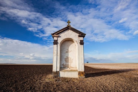 A small chapel in the middle of autumn fields