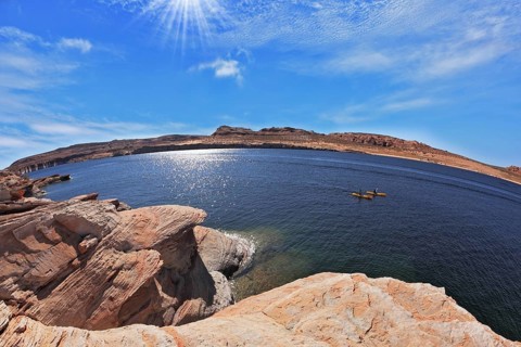 The midday sun in the turquoise water bay. Bottling magnificent Lake Powell photographed by Fisheye