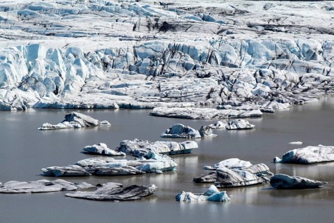 Close-up of Skaftafell glacial tongue, small icebergs in the lake, Iceland