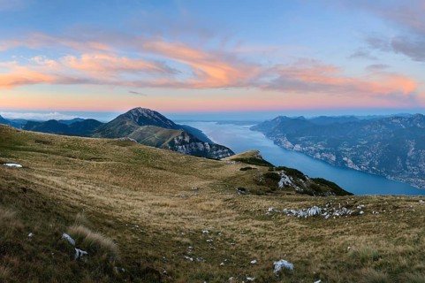 Panorama on top of Monte Altissimo at dusk with lake garda