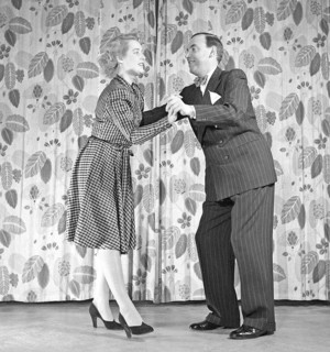 Learning to dance in the 1940s. A couple is dancing together. An instructiv image on how to