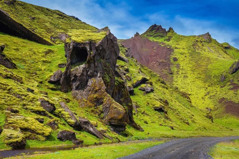 The summer blossoming Iceland. Canyon Pakgil - green grass and moss on freakish rocks