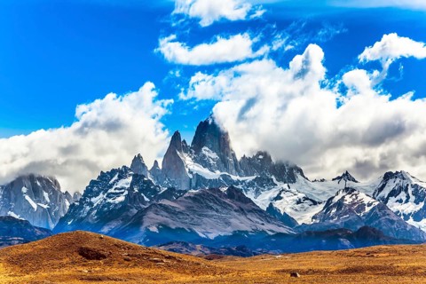 Argentine. Desert and mountains. The famous ridge Mount Fitz Roy in the clouds and the Patagonian