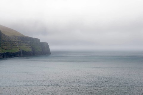 Rocky landscape on the Faroe Islands with cliff and ocean, Eidi, Faroe Islands, Denmark