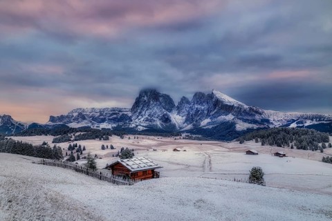 Snowy Alpe di Siusi, Seiser Alm, Sassolungo a Sassoplatto before sunrise