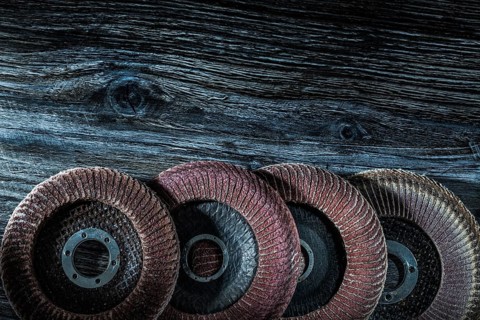 Rotary sanding discs on wooden board