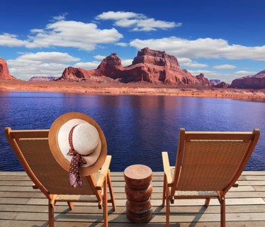 Walk to the tourist boat on Lake Powell on the Colorado River. At the stern of the vessel are two
