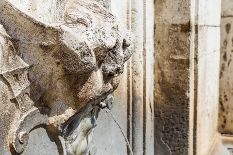 Detail of an ancient fountain in Spoleto Italy