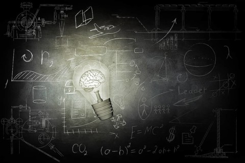 Bulb Illuminates mathematics and business icons on the school chalk board. 3d illustration