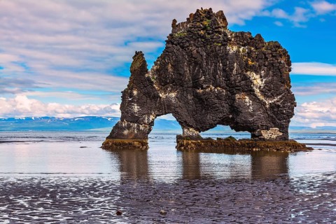 The picturesque cliff in Iceland as huge prehistoric monster. Remains of an ancient extinct volcano