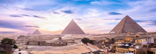 Panoramic view of pyramids and Shinx Cairo at sunset