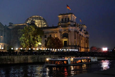 Berlin Reichstag building with light balloons of the former wall