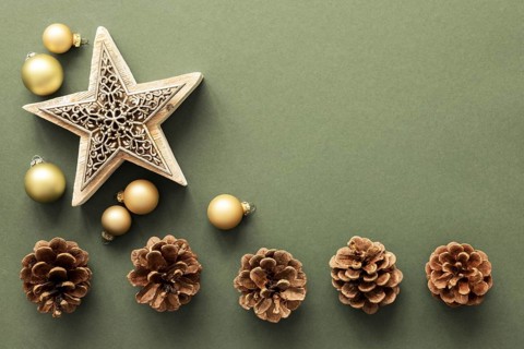 A Christmas decoration background with pine cones and a star