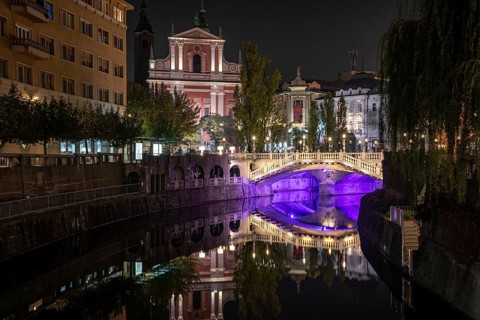 Famous three bridges at the Preseren square in the center of Ljubljana colorfully illuminated at