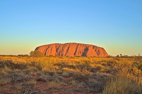 Ayers Rock or Uluru respectively at sun set. Photo shot in 2020