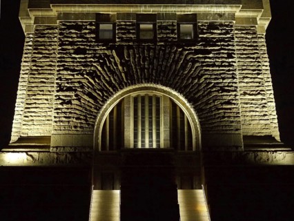 Staircase and masonry at the illuminated Monument to the Battle of the Nations at night. Leipzig,