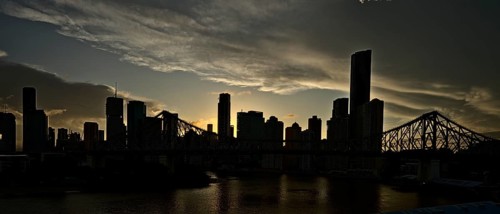 The skyline of Brisbane and the Story Bridge at nighttime